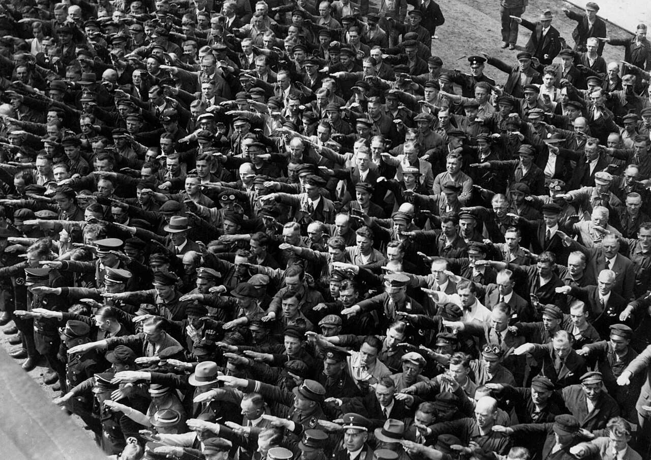 Workers at the Blohm & Voss dockyards giving Hitler salute (except for one person)