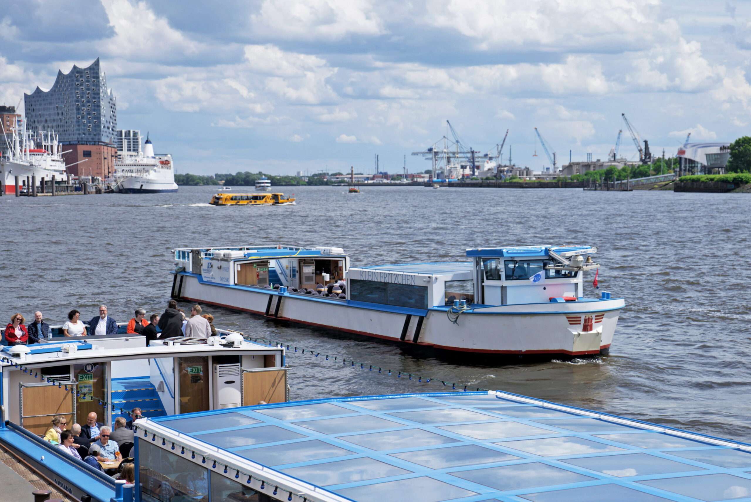 boat tour vessel with elbphilharmonie on the background