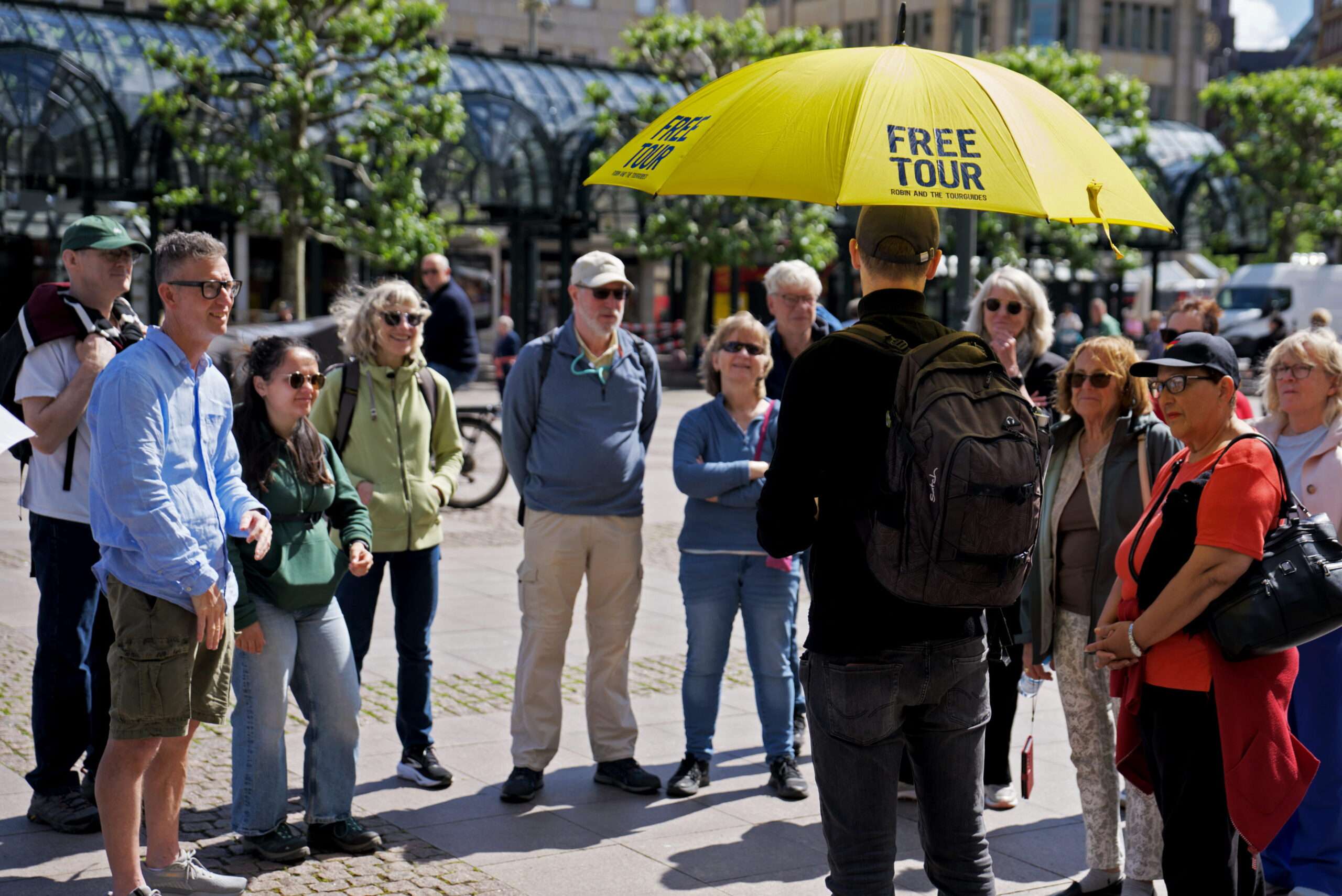 tourists enjoying the free walking tour in hamburg