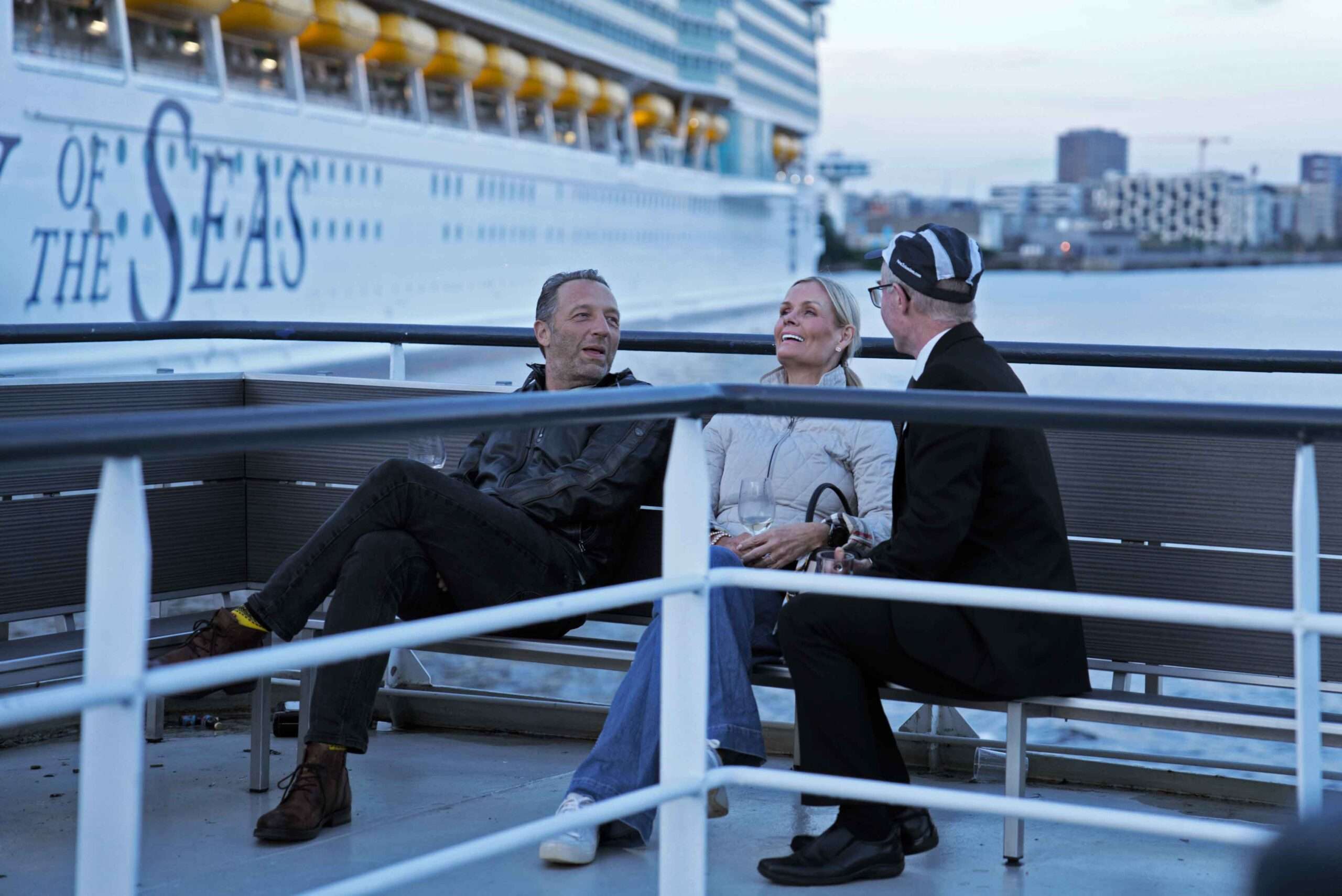 a cheerful conversation on a cruise ship