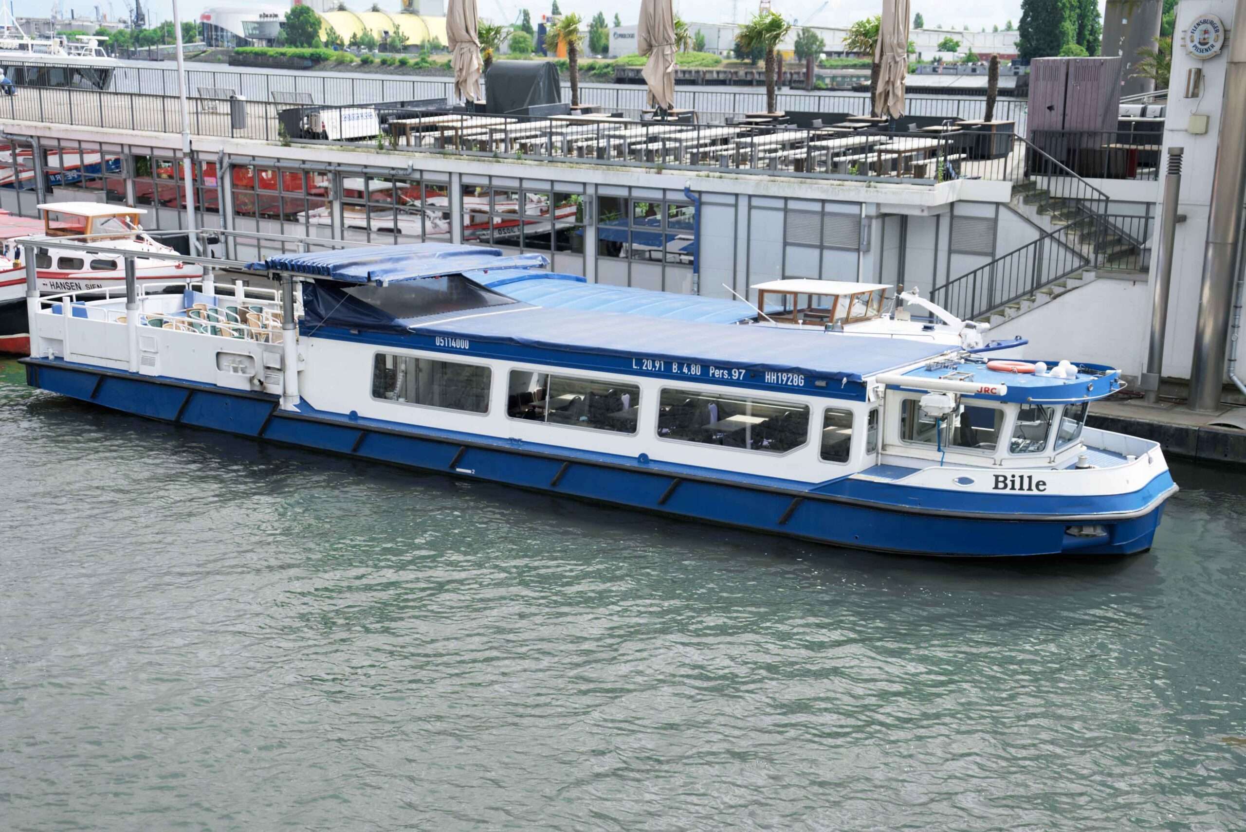 blue boat docked in hamburg